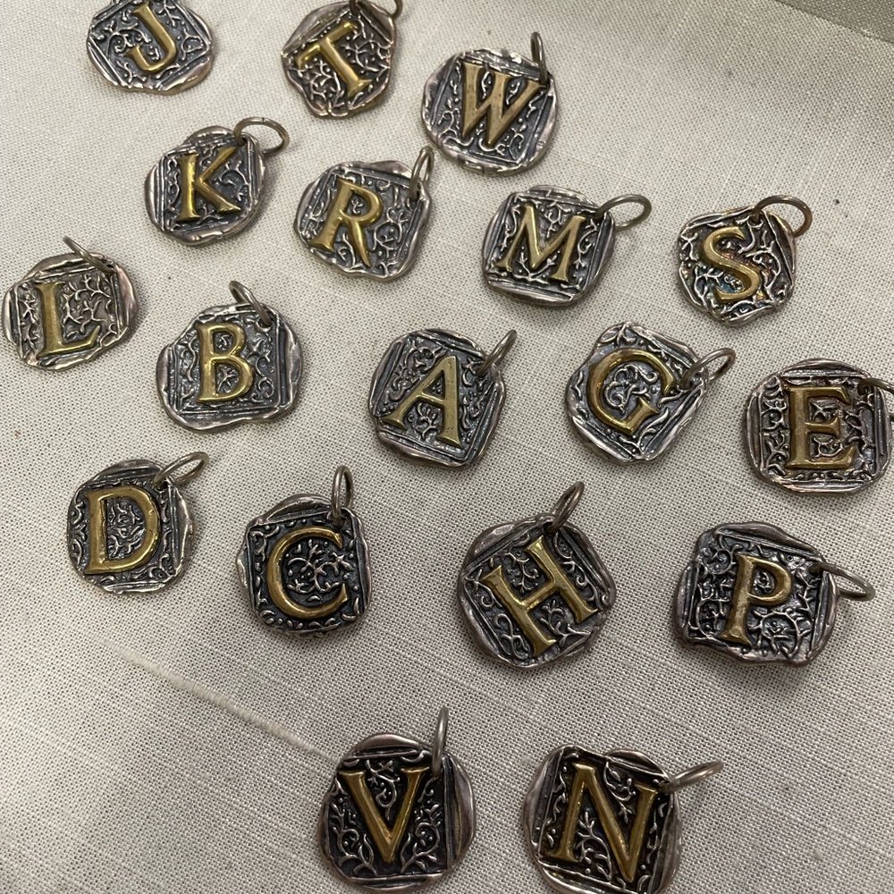 Waxing Poetic Charms. Initials.